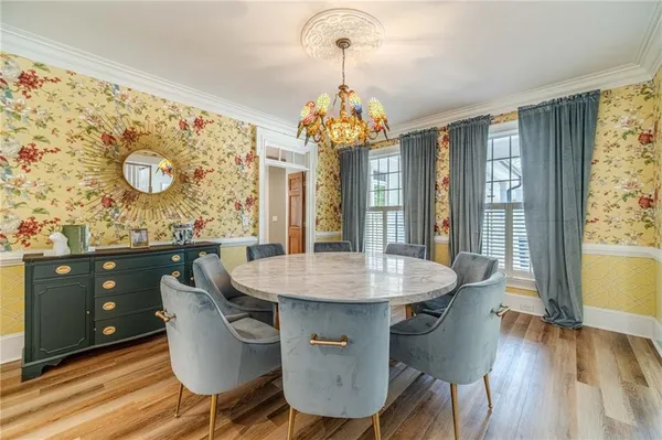 a large kitchen with granite countertop a large counter top space and stainless steel appliances