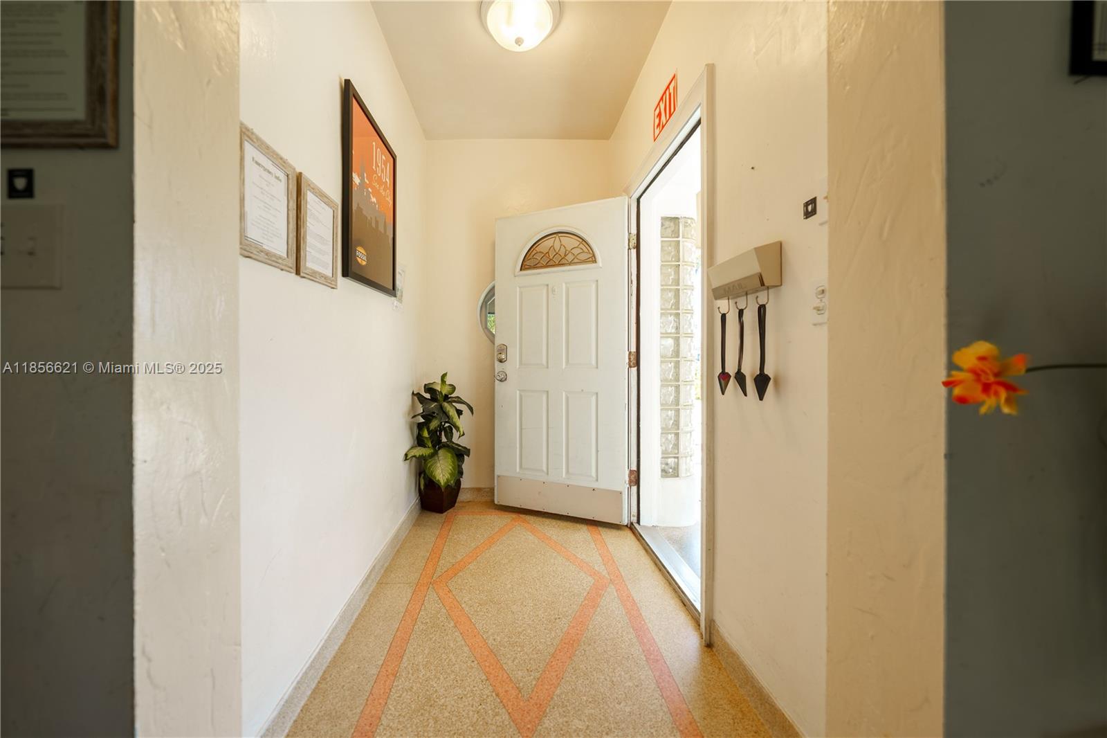 701 Hollywood Boulevard, Unit 701 Hollywood, FL 33019 - Photo 14 of 27 a view of a hallway with wooden floor and staircase
