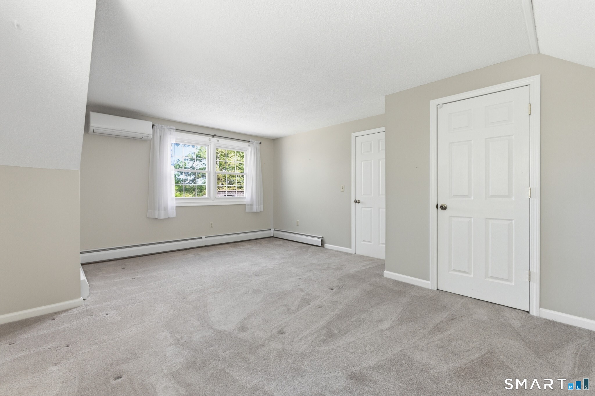 70 Mahoney Road Colchester, CT 06415 - Photo 27 of 40 an empty room with windows