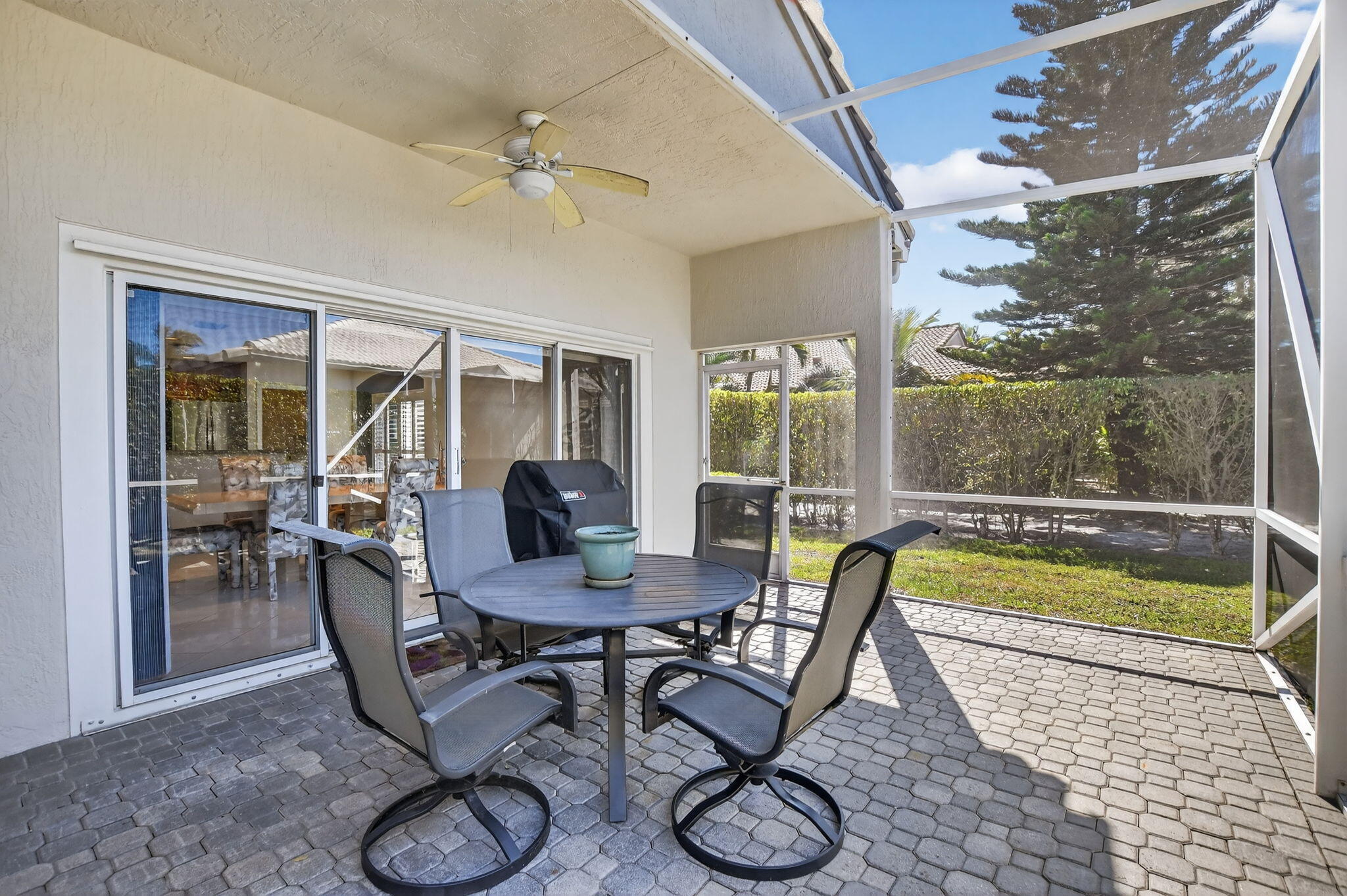 23429 Rakelle Circle Boca Raton, FL 33433 - Photo 28 of 75 a dining room with furniture and a floor to ceiling window