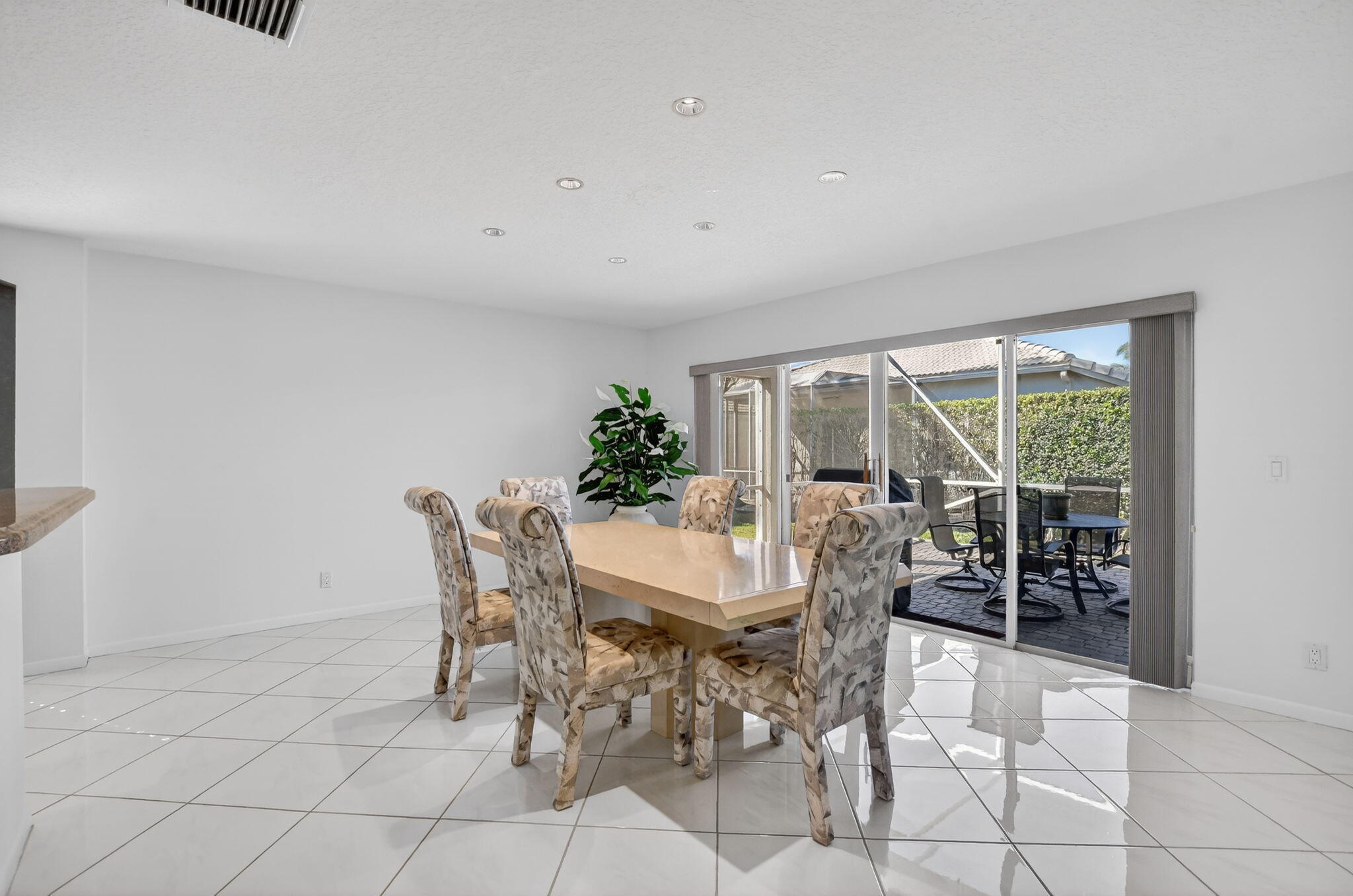 23429 Rakelle Circle Boca Raton, FL 33433 - Photo 53 of 75 a view of a dining room with furniture window and outside view