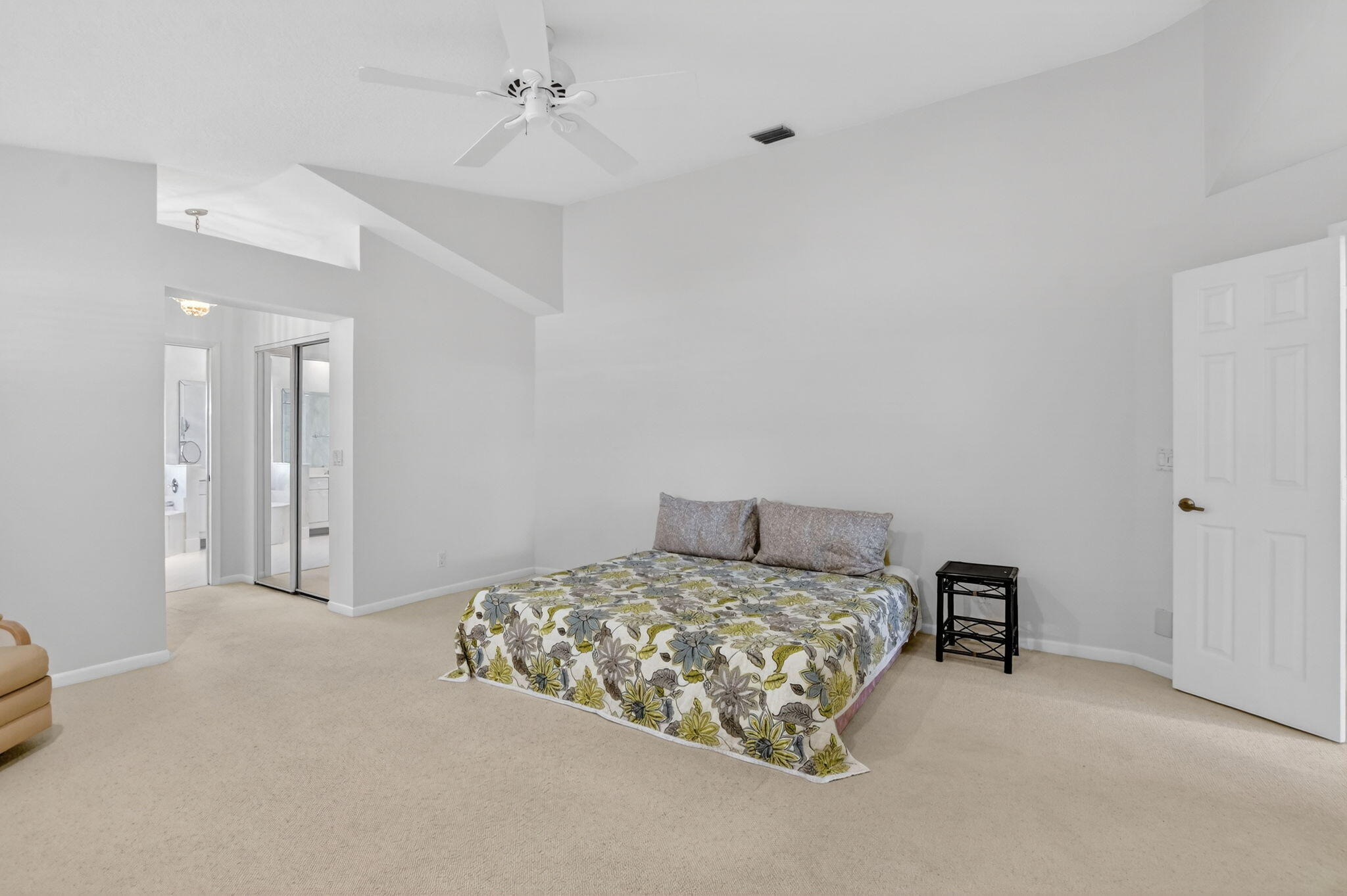 23429 Rakelle Circle Boca Raton, FL 33433 - Photo 60 of 75 a bedroom with a bed and a cabinets
