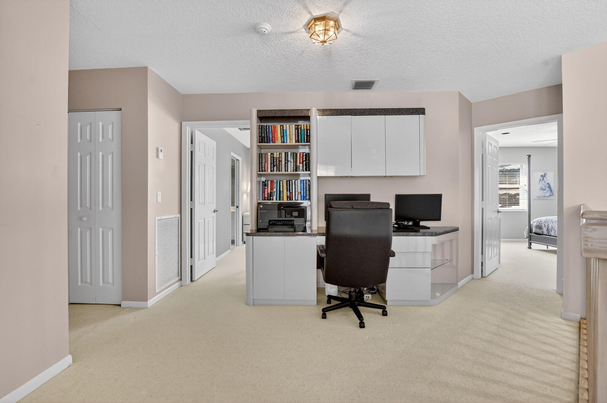23429 Rakelle Circle Boca Raton, FL 33433 - Photo 68 of 75 a view of a workspace with furniture and a window