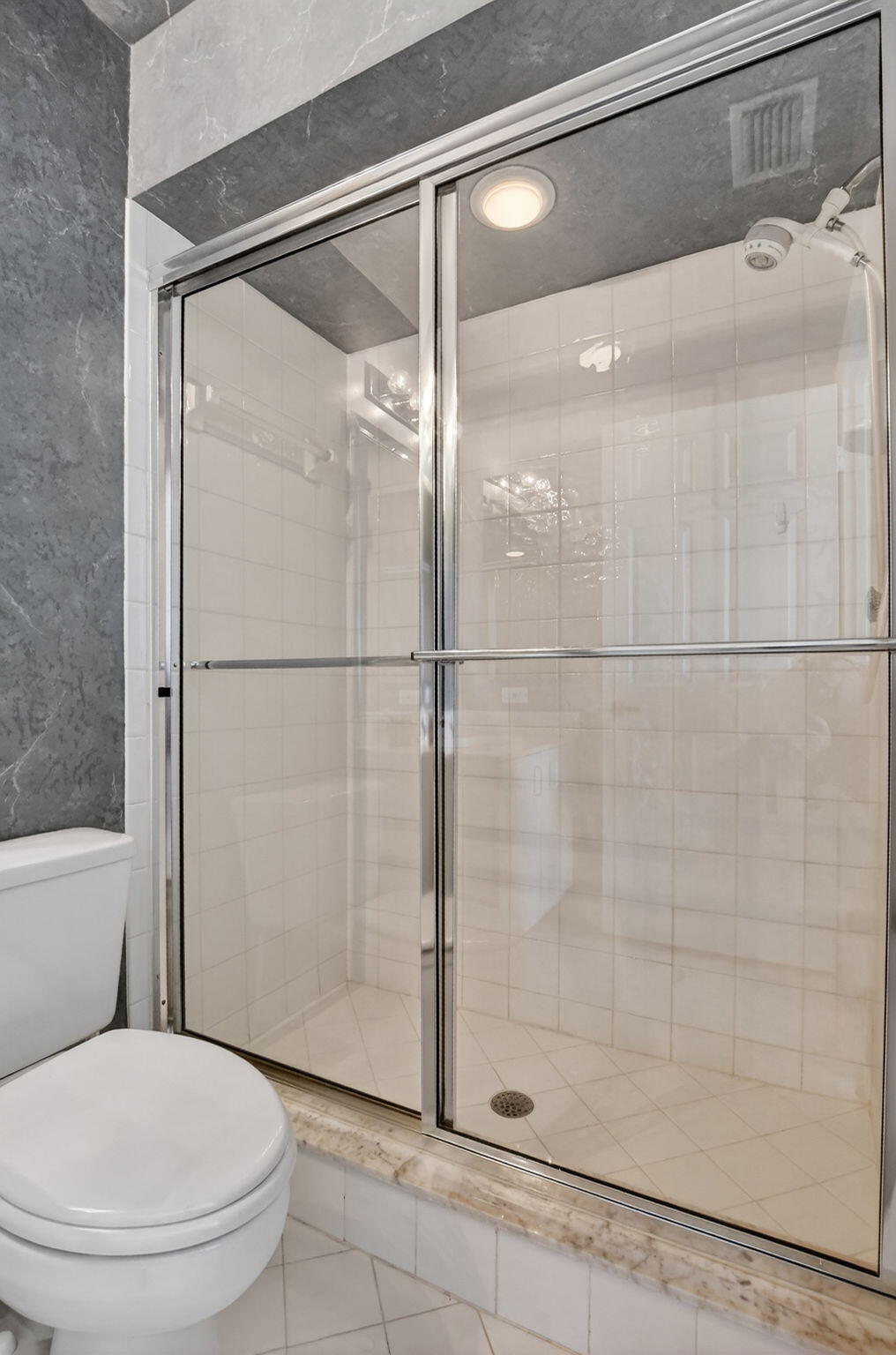 23429 Rakelle Circle Boca Raton, FL 33433 - Photo 70 of 75 a bathroom with a toilet and a shower