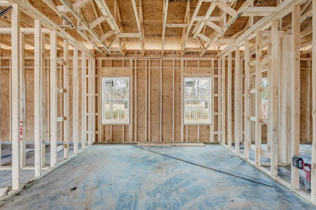 a view of an empty room with wooden walls