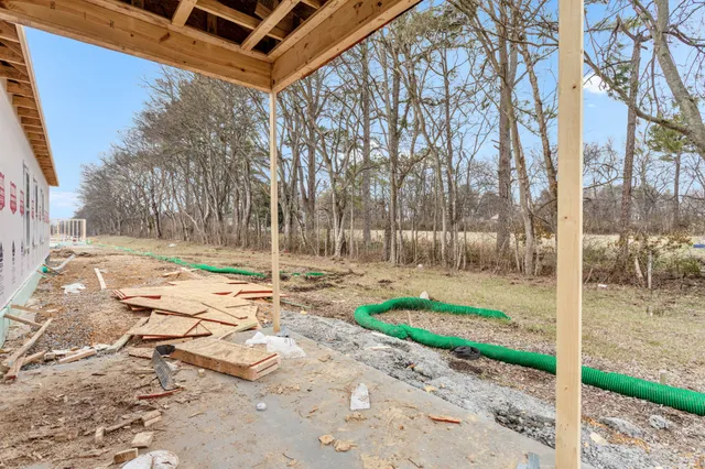 a backyard of a house with lots of green space
