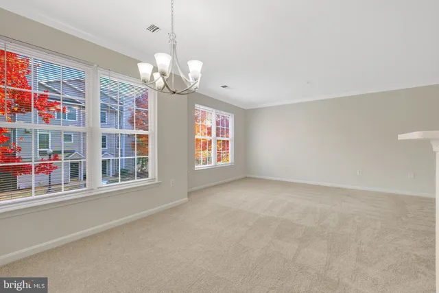a kitchen with stainless steel appliances a refrigerator and a stove top oven