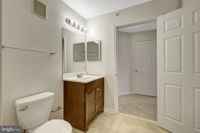 a utility room with cabinets washer and dryer