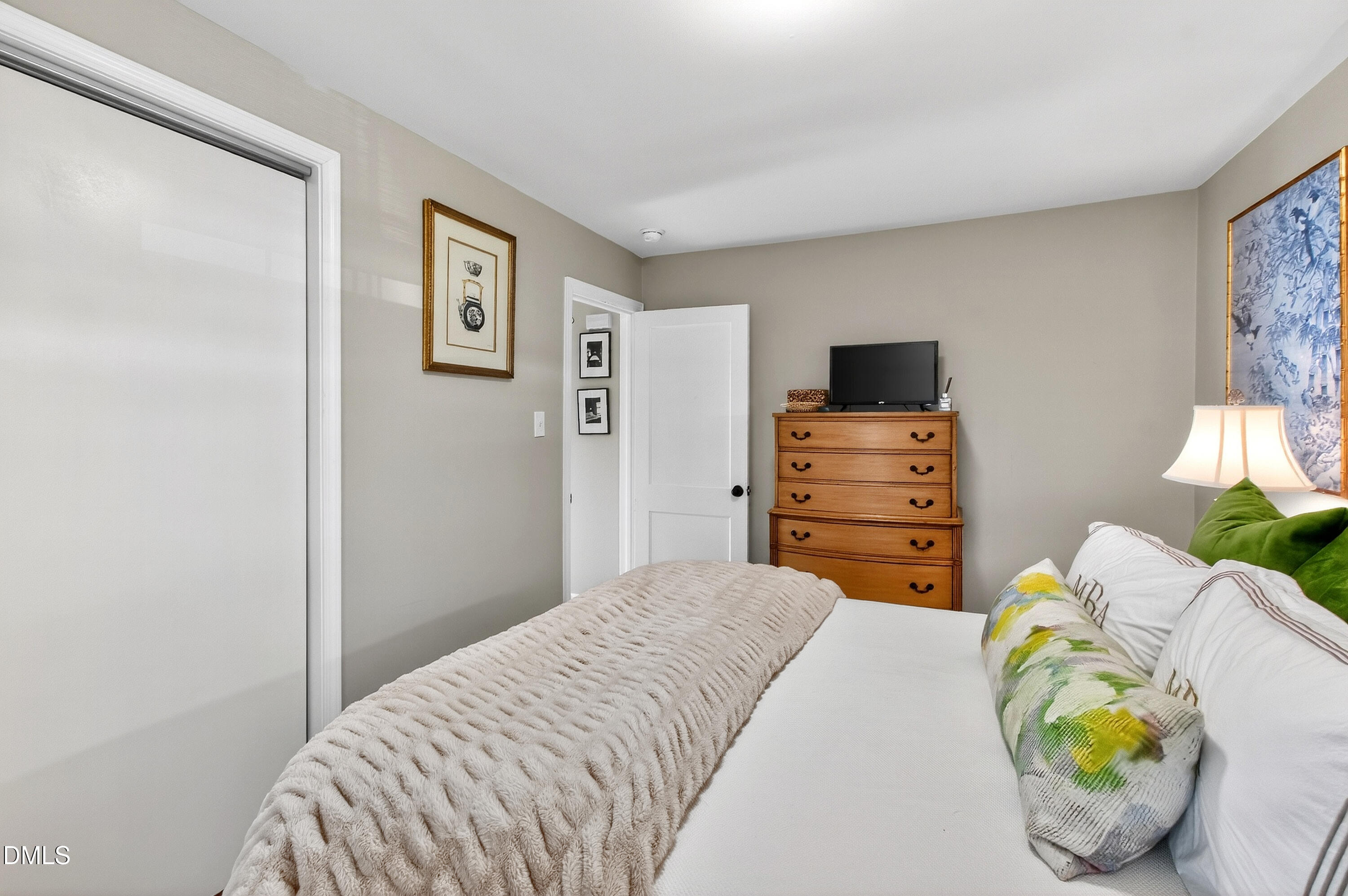 1802 Rankin Street Raleigh, NC 27604 - Photo 23 of 37 a bedroom with a bed and furniture