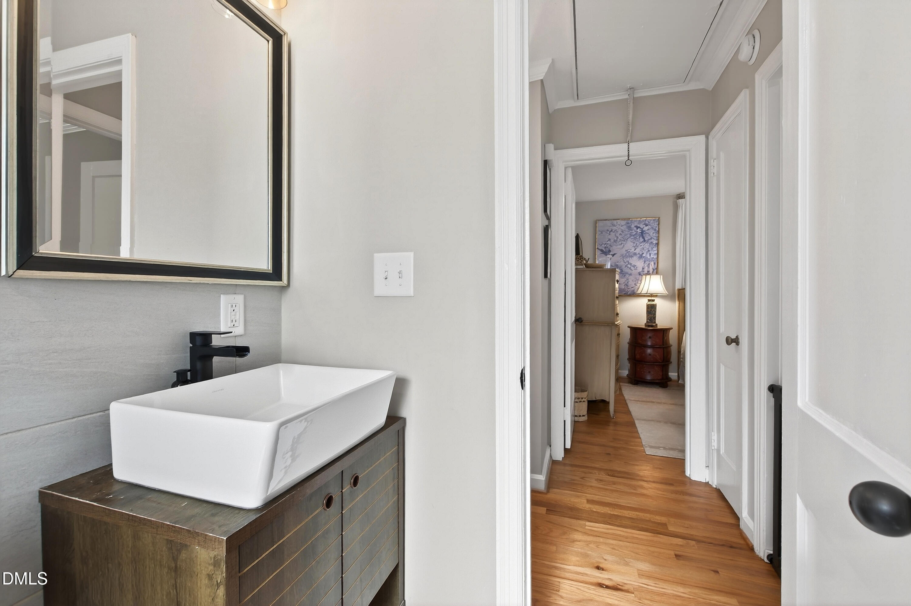 1802 Rankin Street Raleigh, NC 27604 - Photo 24 of 37 a bathroom with a sink and a mirror