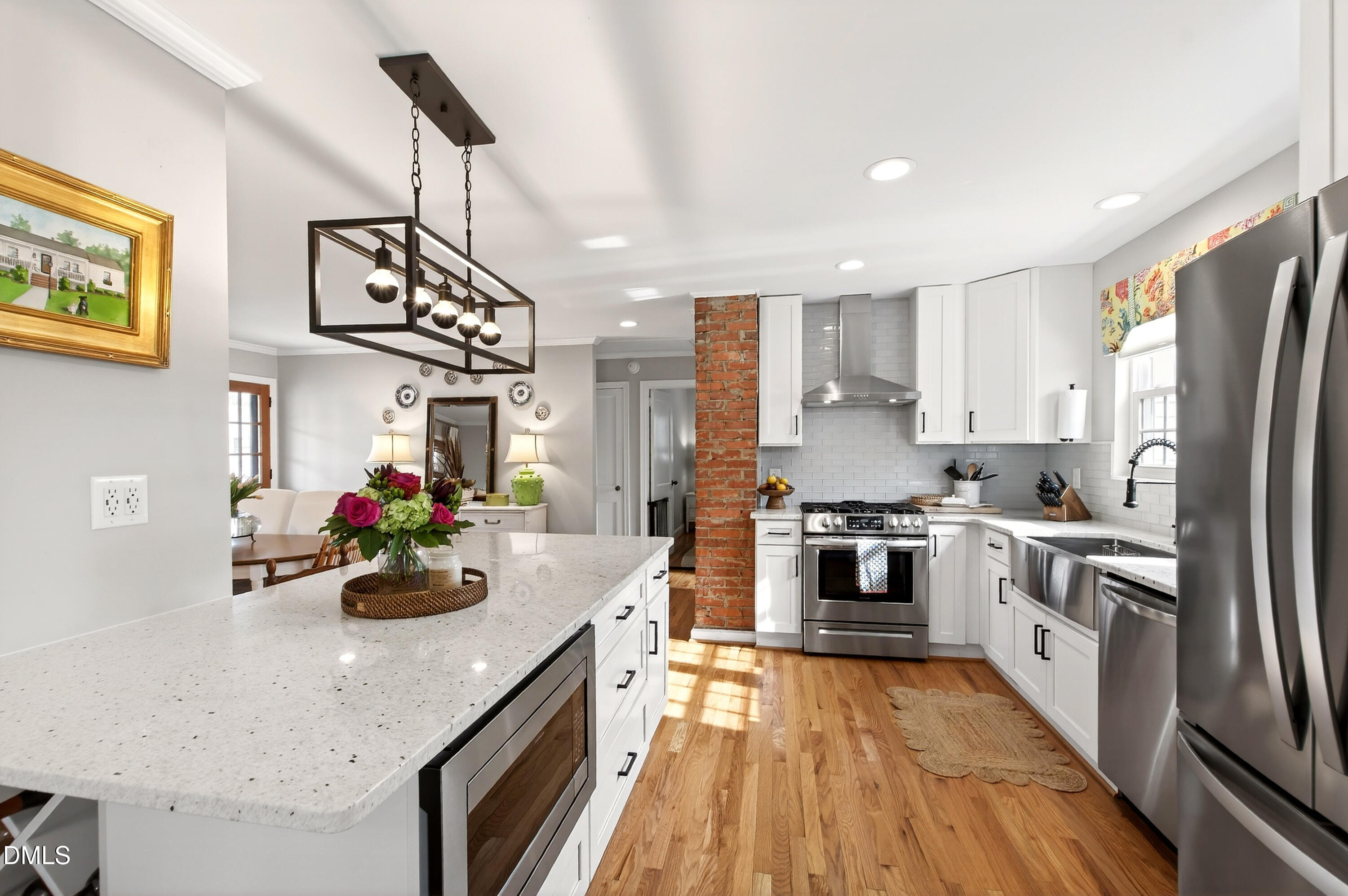 1802 Rankin Street Raleigh, NC 27604 - Photo 7 of 37 a kitchen with stainless steel appliances a sink dishwasher stove refrigerator and cabinets