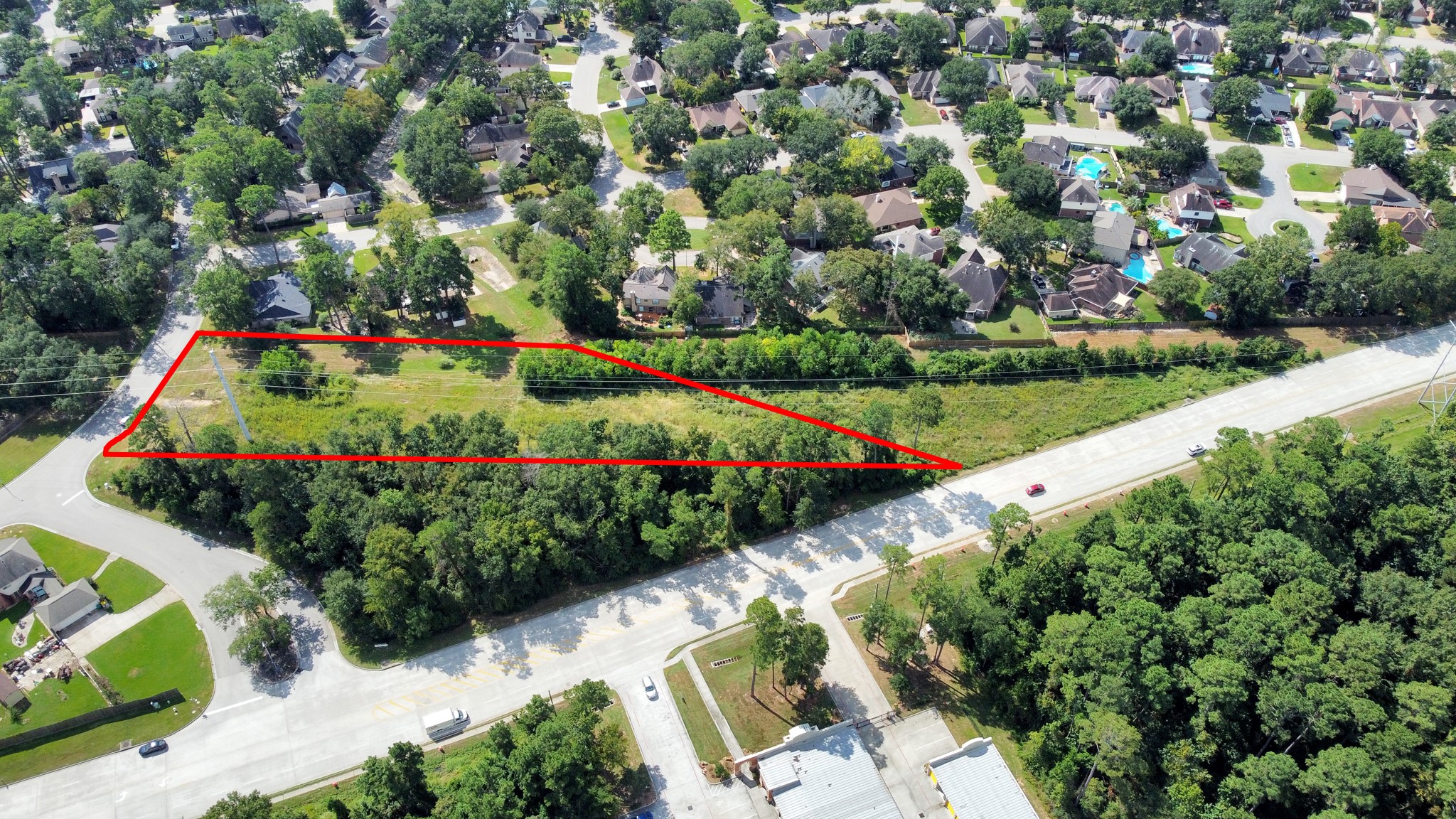 Tbd Tbd Rivershire Conroe, TX 77304 - Photo 3 of 9 a view of a garden with flowers and trees