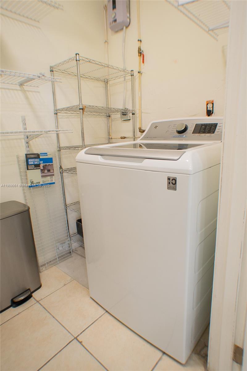 12800 Southwest 43rd Drive, Unit 210B Miami, FL 33175 - Photo 14 of 25 a utility room with dryer and washer