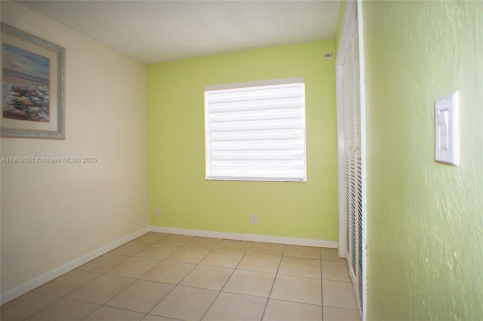 12800 Southwest 43rd Drive, Unit 210B Miami, FL 33175 - Photo 25 of 25 a view of an empty room with a window