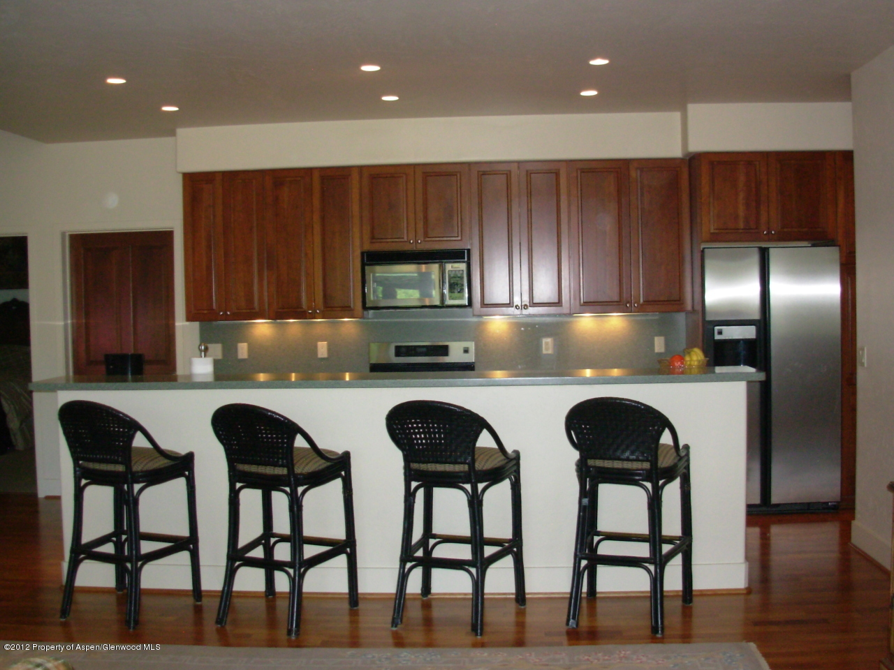 405 Meadow Court Basalt, CO 81621 - Photo 11 of 25 a kitchen with cabinets a sink and appliances