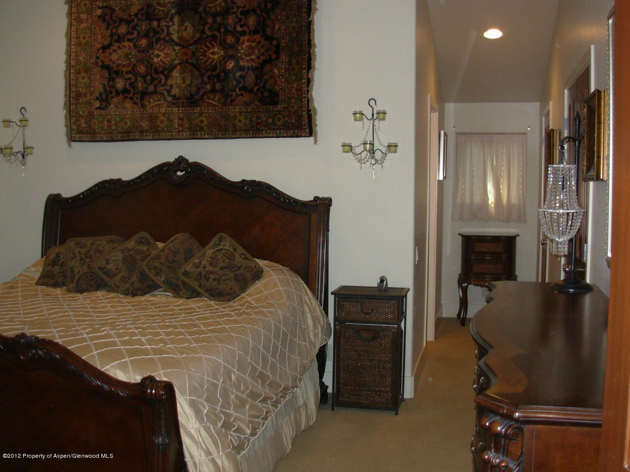 405 Meadow Court Basalt, CO 81621 - Photo 16 of 25 a bed sitting in a room next to a window