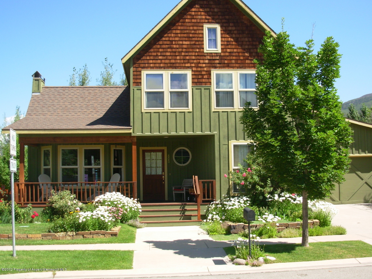 405 Meadow Court Basalt, CO 81621 - Photo 2 of 25 a front view of a house with garden