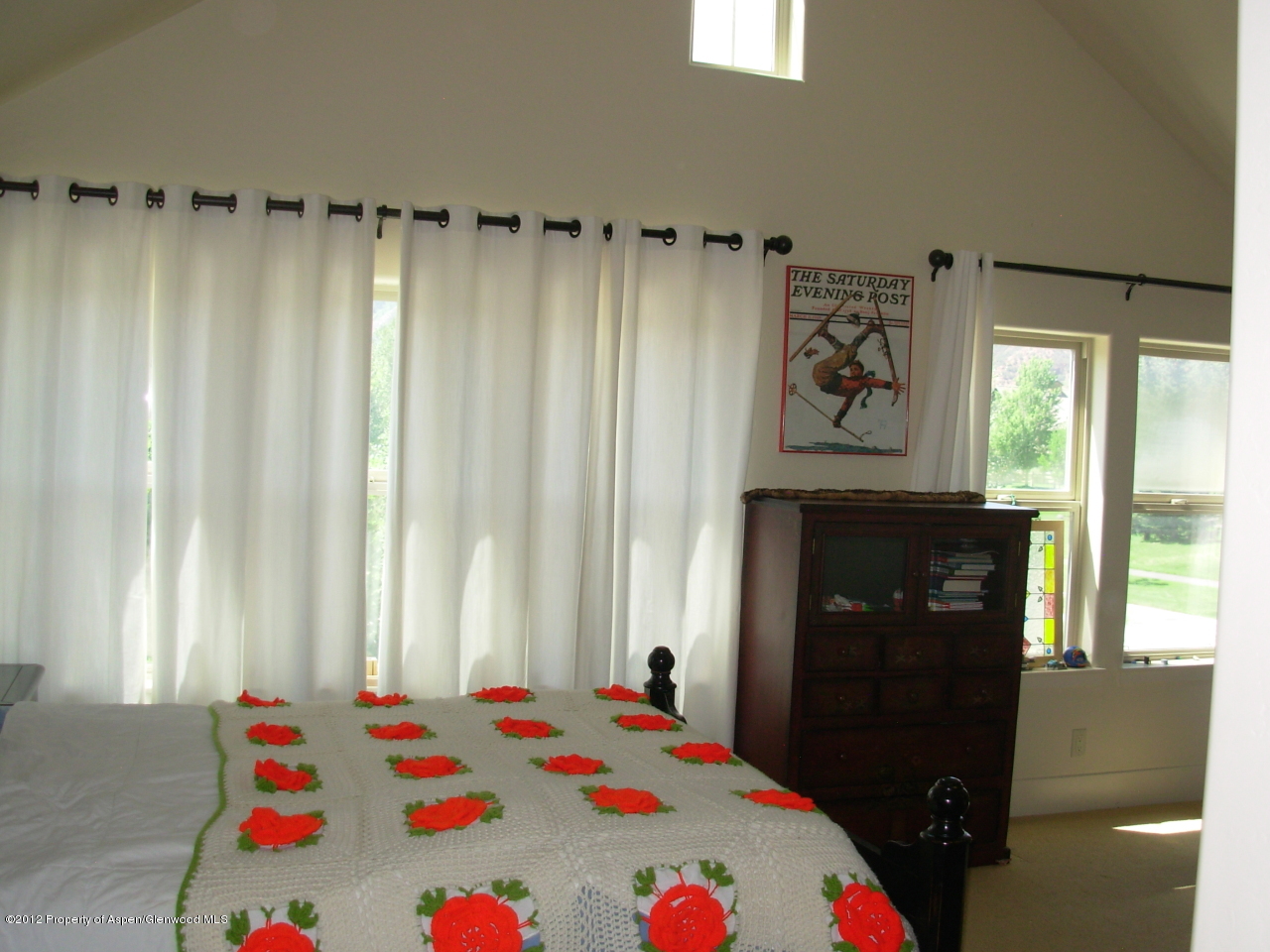 405 Meadow Court Basalt, CO 81621 - Photo 21 of 25 a bedroom with a bed and a window