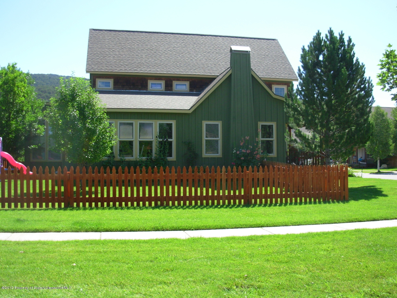 405 Meadow Court Basalt, CO 81621 - Photo 3 of 25 a view of a house with a big yard and potted plants