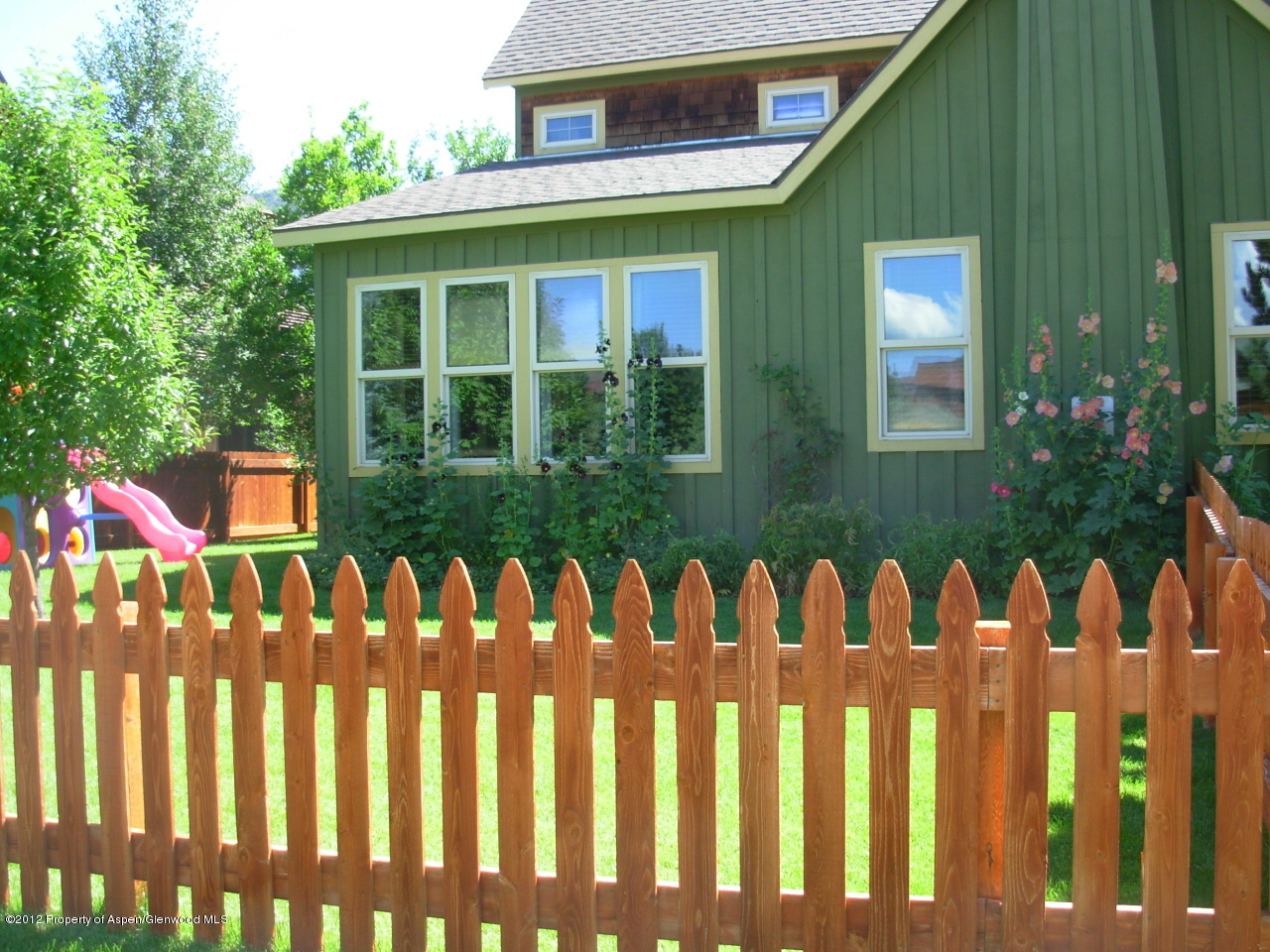 405 Meadow Court Basalt, CO 81621 - Photo 4 of 25 a front view of a house with a garden