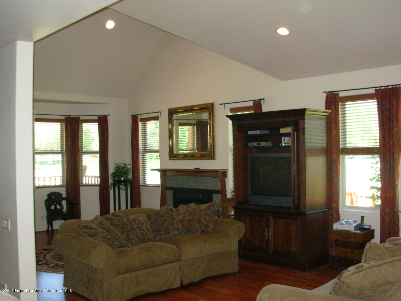405 Meadow Court Basalt, CO 81621 - Photo 9 of 25 a living room with furniture and a flat screen tv