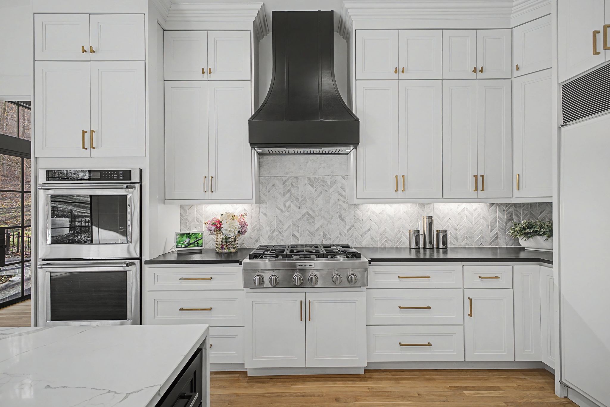 6339 Johnson Chapel Road West Brentwood, TN 37027 - Photo 17 of 82 a kitchen with white cabinets and stainless steel appliances
