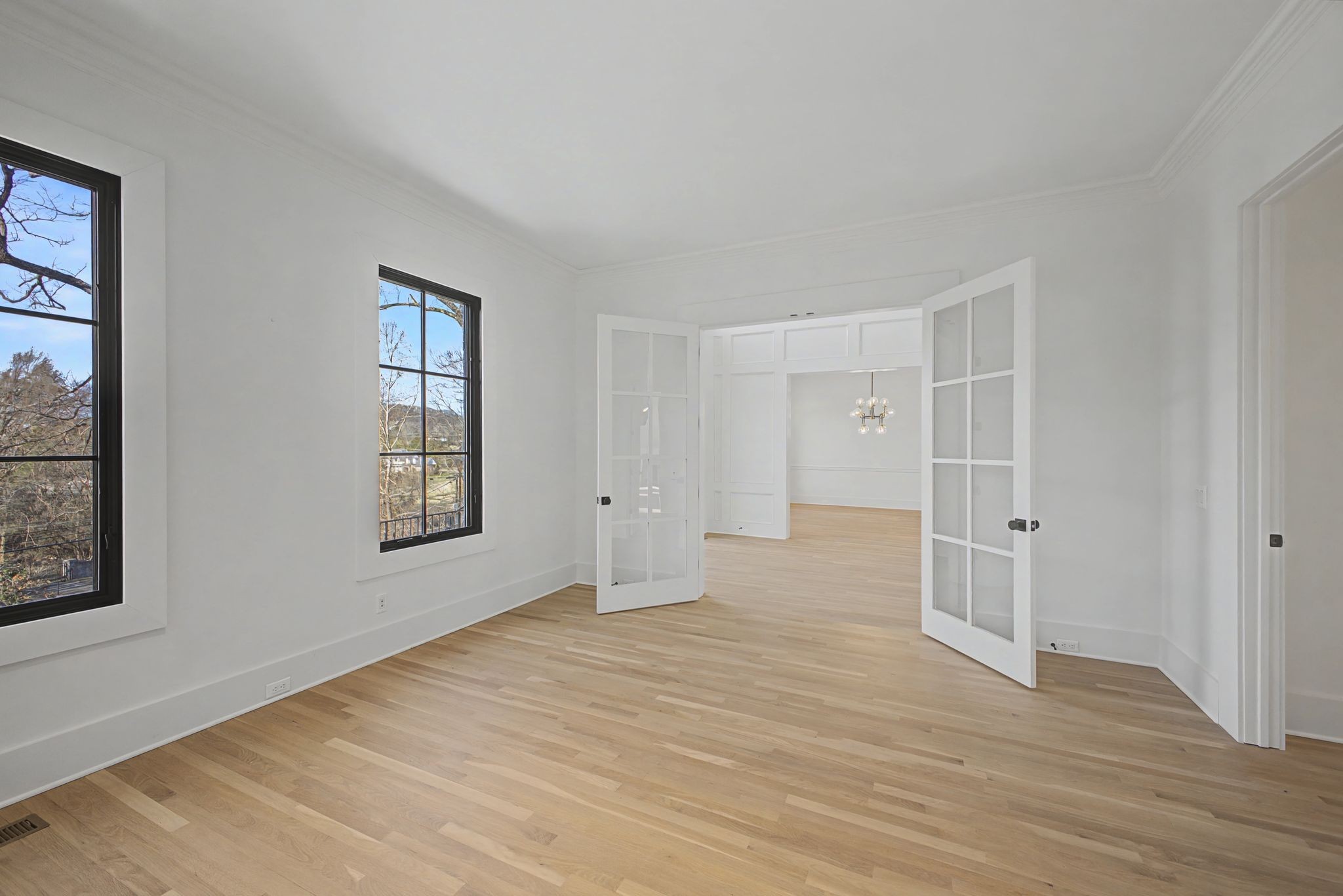 6339 Johnson Chapel Road West Brentwood, TN 37027 - Photo 8 of 82 a view of an empty room with wooden floor and a window