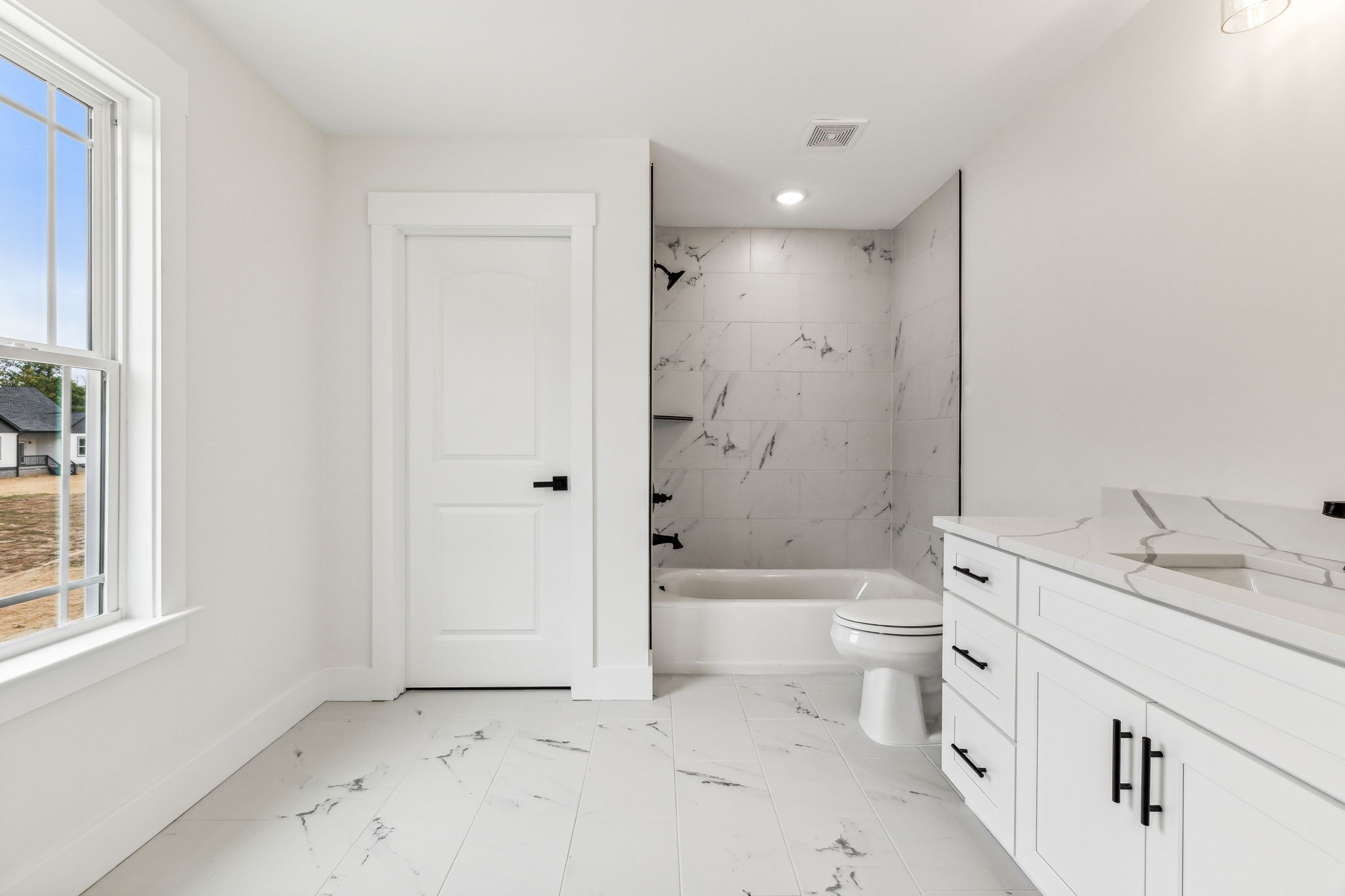 6457 Hopewell Road Springfield, TN 37172 - Photo 48 of 62 a bathroom with a granite countertop sink a toilet and shower