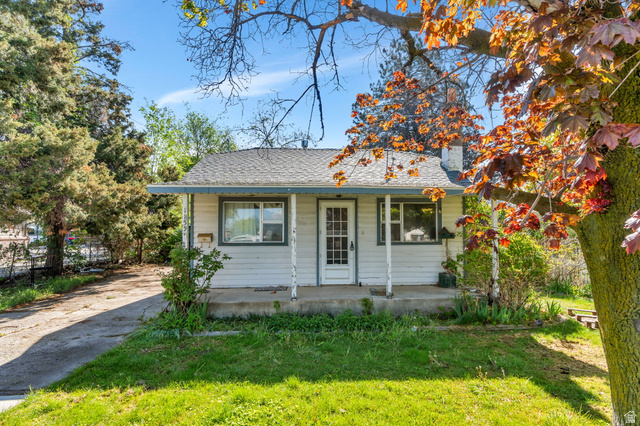 Undisclosed Address Springville, UT 84663 - Photo 1 of 1 Bungalow with covered porch, a front lawn, a chimney, and a shingled roof