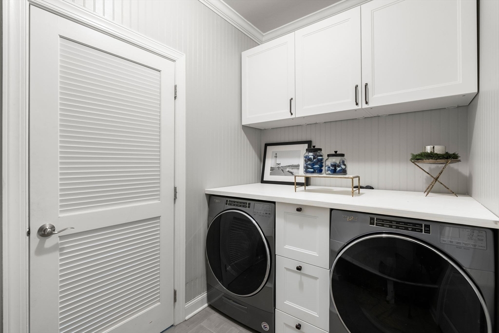 2 Hummingbird Way, Unit 1 Methuen, MA 01844 - Photo 21 of 42 a utility room with sink dryer and washer