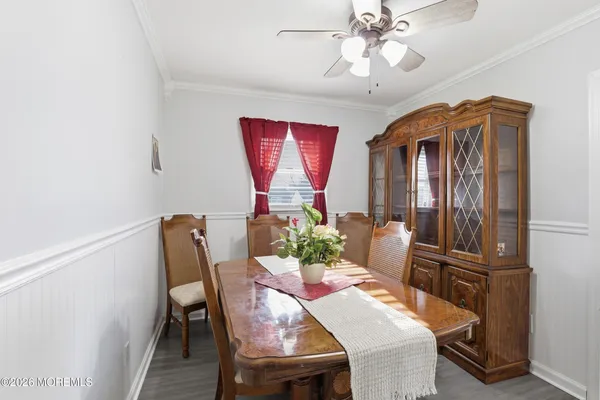 a view of a dining room with furniture window and wooden floor