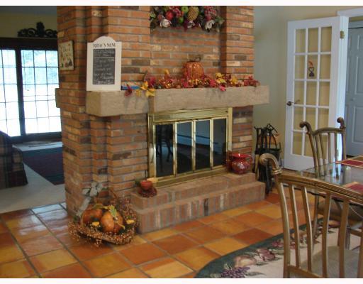 459 Three Degree Road Renfrew, PA 16053 - Photo 9 of 18 Kitchen. Two-sided wood burning fireplace in eat-in kitchen area