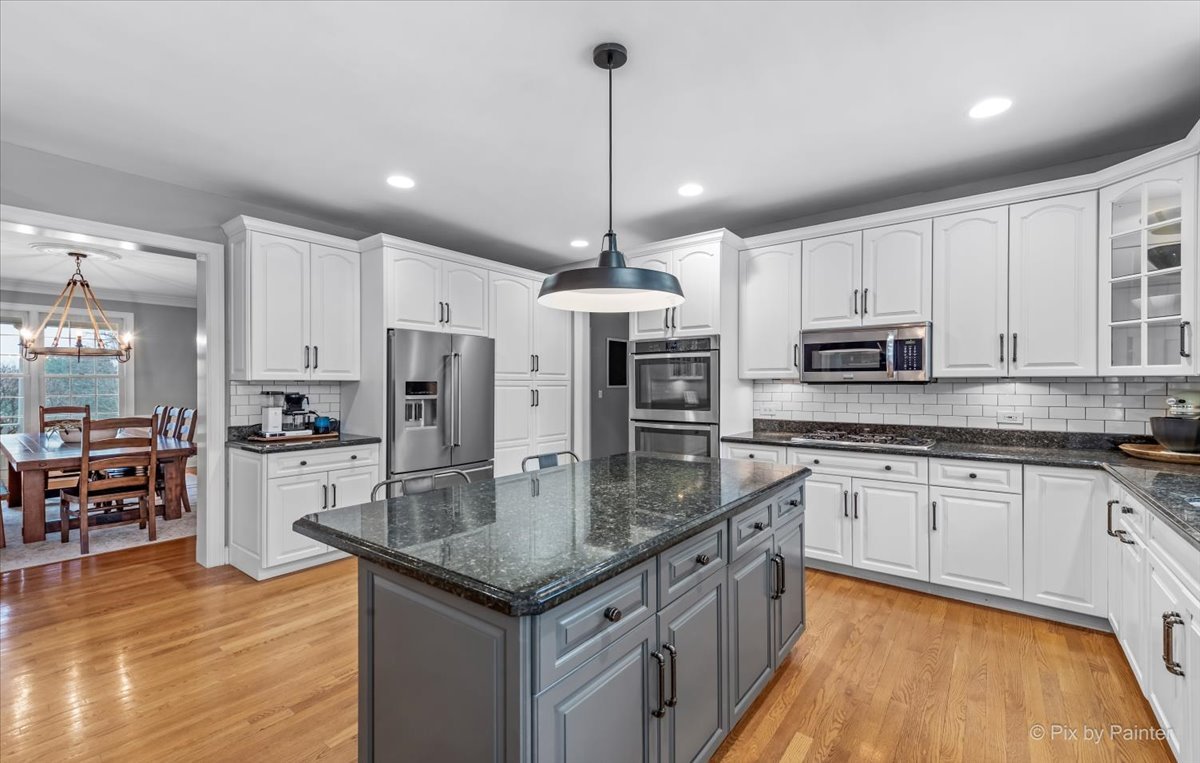 7N580 Wagontire Road St. Charles, IL 60175 - Photo 12 of 52 a kitchen with stainless steel appliances granite countertop a sink refrigerator and cabinets