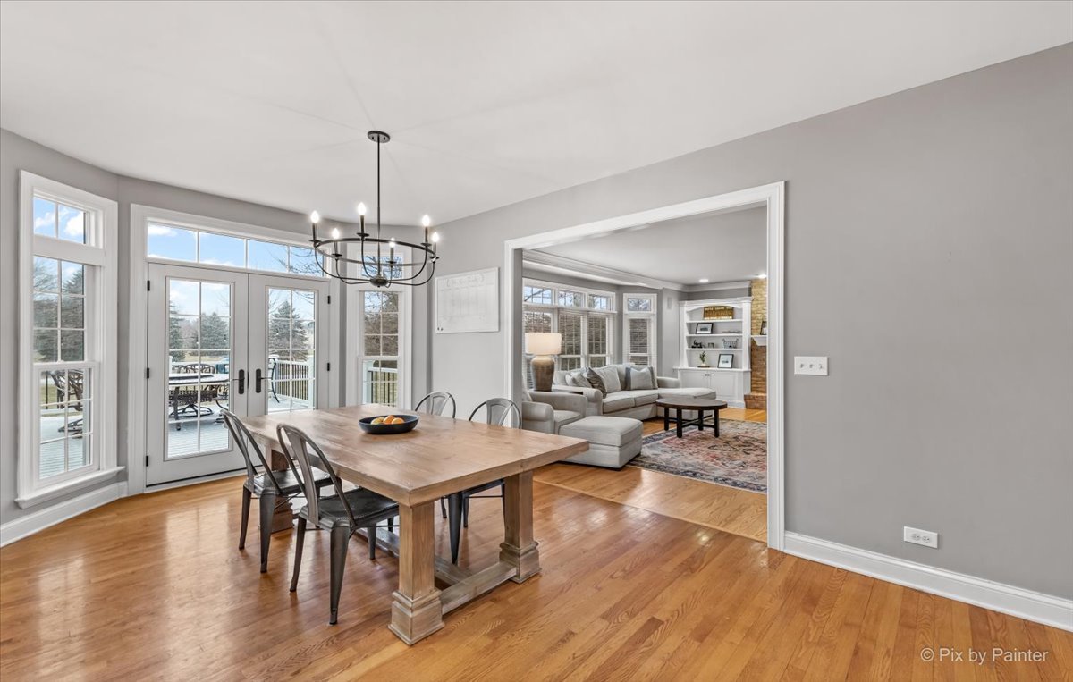 7N580 Wagontire Road St. Charles, IL 60175 - Photo 15 of 52 a view of a dining room with furniture window and wooden floor