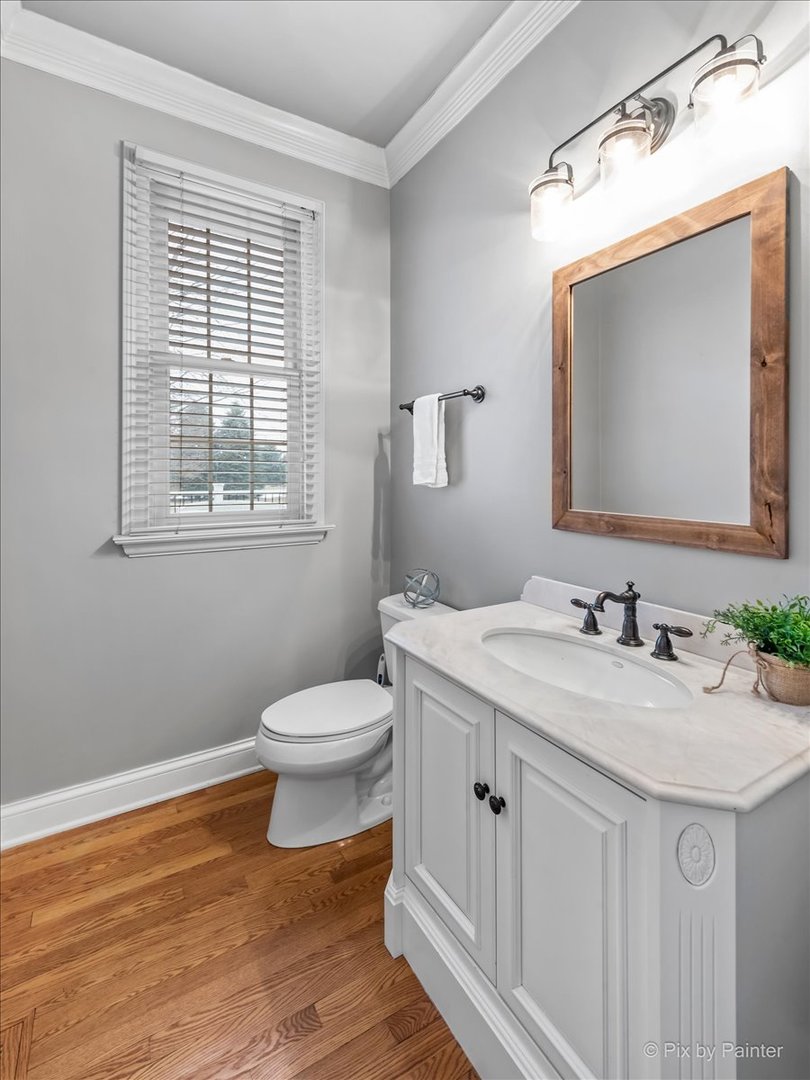 7N580 Wagontire Road St. Charles, IL 60175 - Photo 20 of 52 a bathroom with a toilet a sink a vanity and mirror
