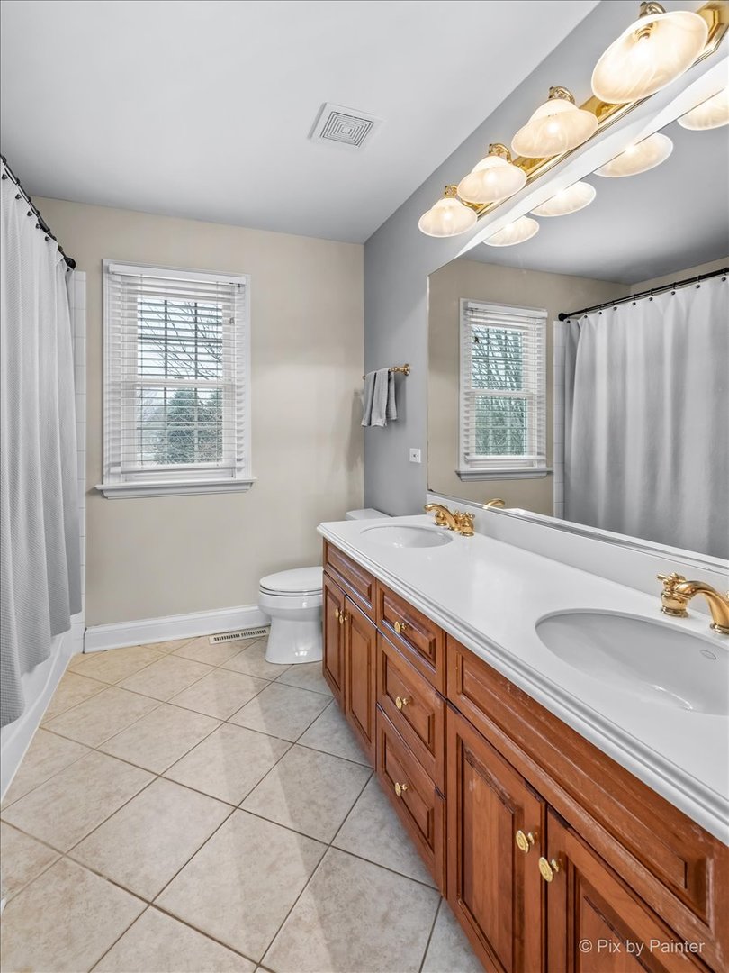 7N580 Wagontire Road St. Charles, IL 60175 - Photo 29 of 52 a spacious bathroom with a granite countertop sink a toilet and a tub