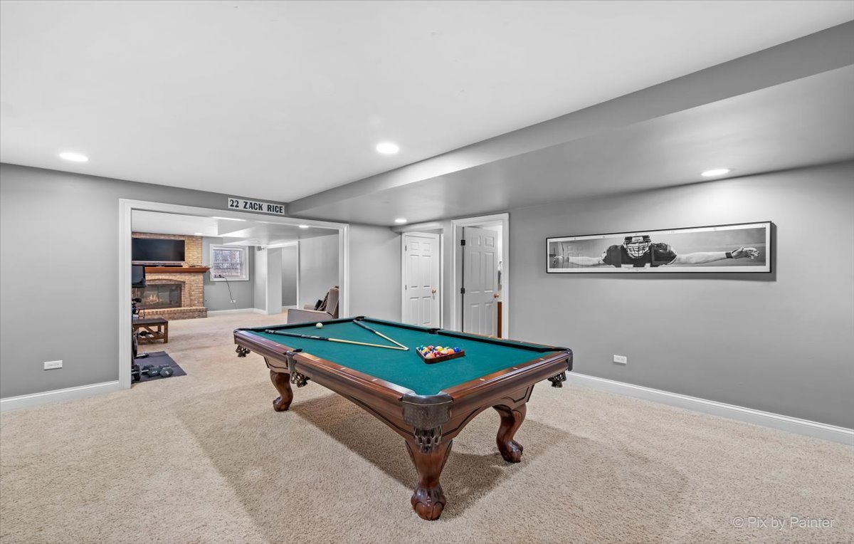 7N580 Wagontire Road St. Charles, IL 60175 - Photo 33 of 52 a room with pool table and paintings on the wall