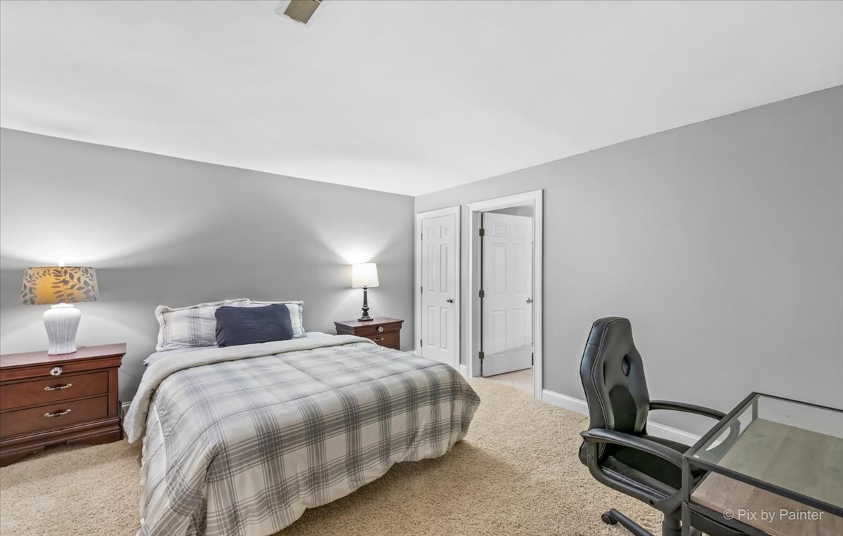 7N580 Wagontire Road St. Charles, IL 60175 - Photo 36 of 52 a bedroom with a bed a couch and dresser