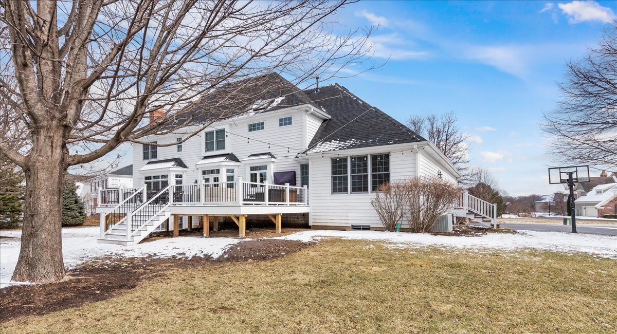 7N580 Wagontire Road St. Charles, IL 60175 - Photo 43 of 52 a view of a white house with a yard covered in snow