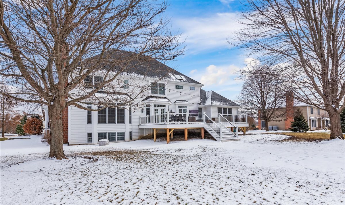7N580 Wagontire Road St. Charles, IL 60175 - Photo 44 of 52 a view of a white house with a snow on the road