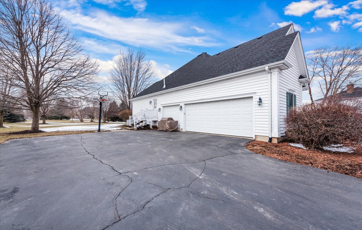 7N580 Wagontire Road St. Charles, IL 60175 - Photo 45 of 52 a view of a house with a yard and garage