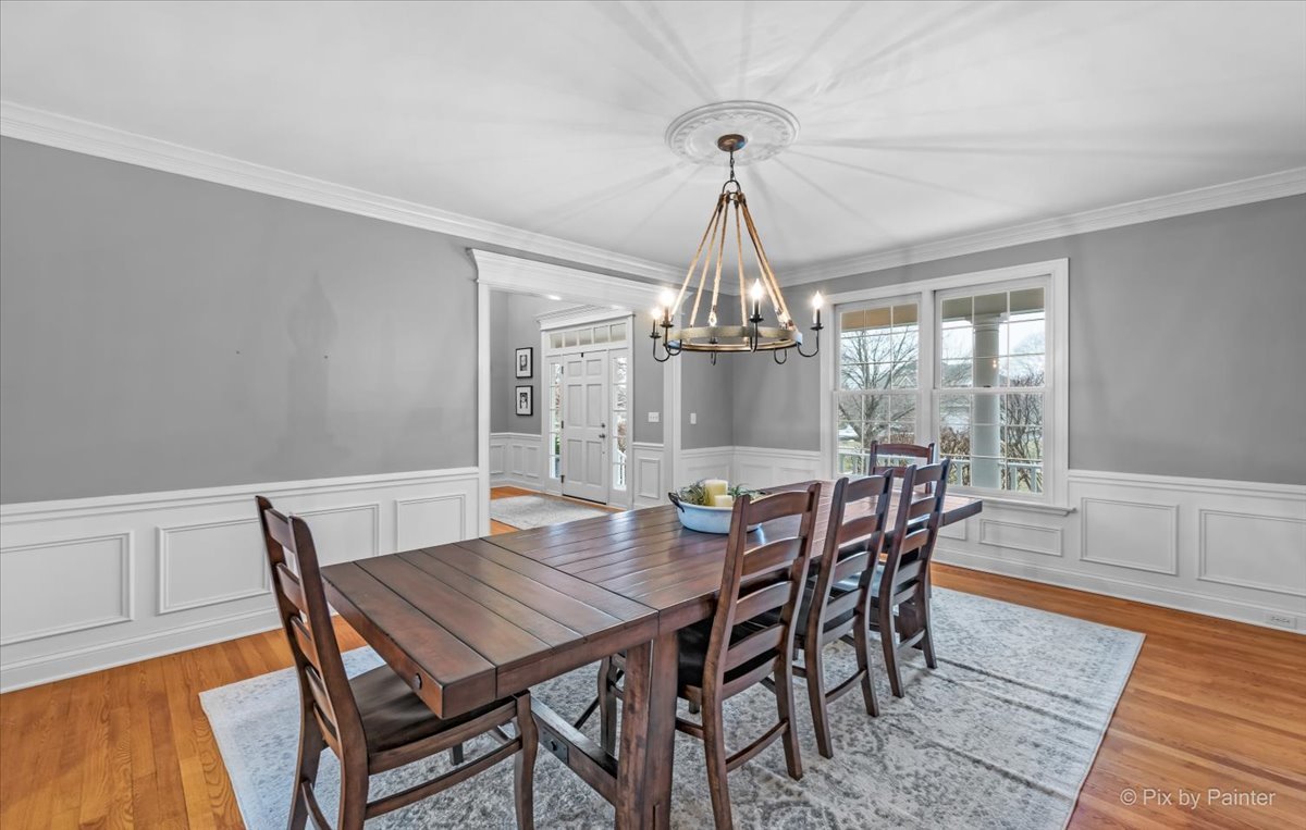 7N580 Wagontire Road St. Charles, IL 60175 - Photo 8 of 52 a view of a dining room with furniture window and wooden floor