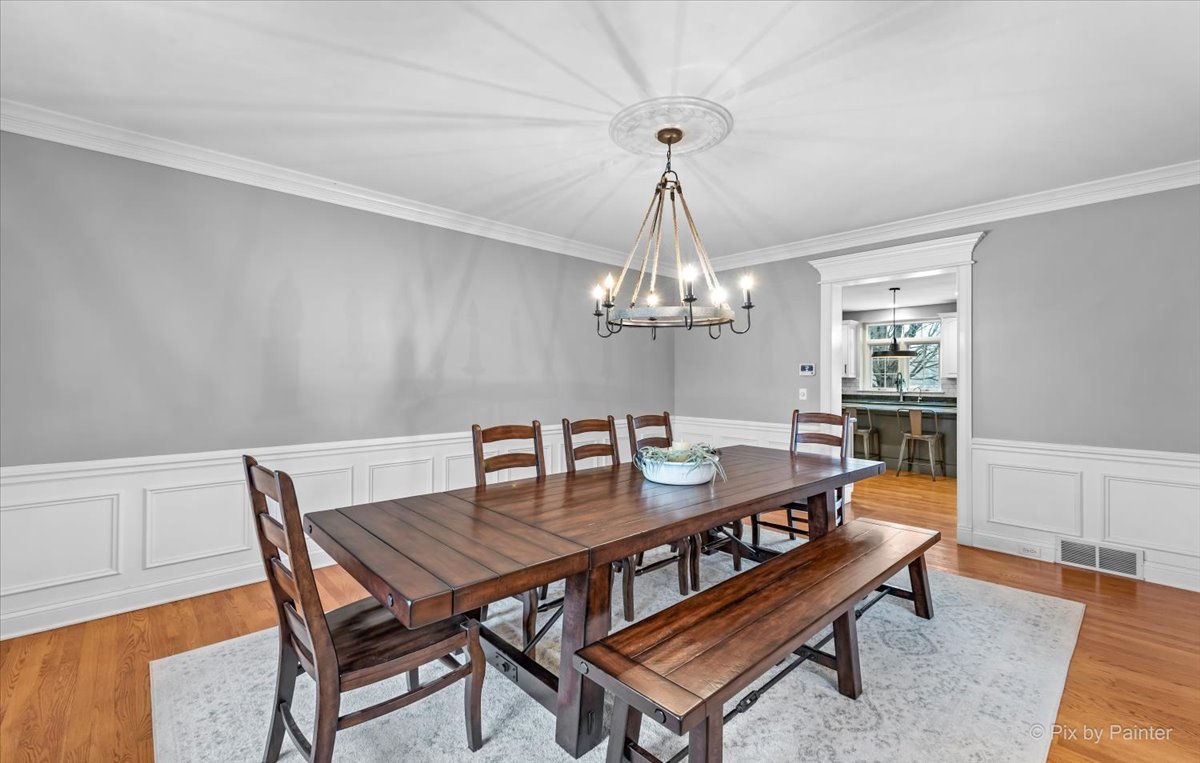 7N580 Wagontire Road St. Charles, IL 60175 - Photo 9 of 52 a dining room with a wooden table and chairs