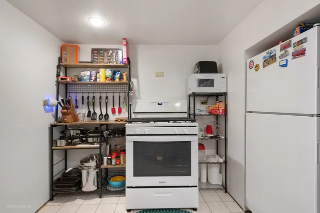 a kitchen with stainless steel appliances a stove and a refrigerator