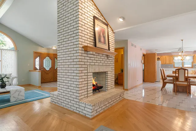 a view of a livingroom with furniture and a fireplace