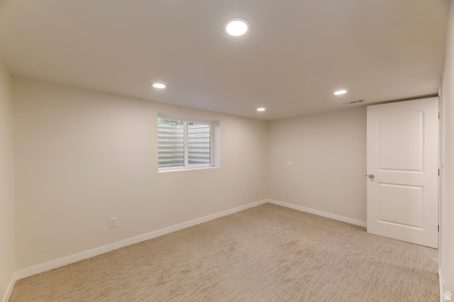 4658 Box Elder Street Salt Lake City, UT 84107 - Photo 12 of 17 Neutral tone walls and beige carpeting create a versatile interior