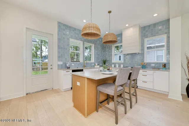 a kitchen with cabinets a sink and appliances