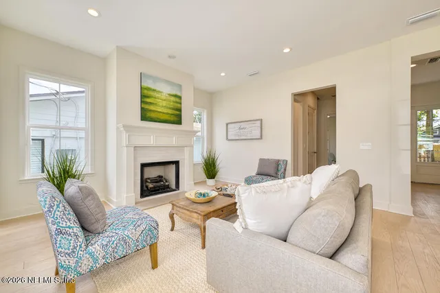 a living room with furniture and a fireplace