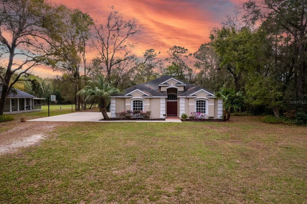 24520 Rolling Oak Road Sorrento, FL 32776 - Photo 1 of 1 a front view of a house with a yard
