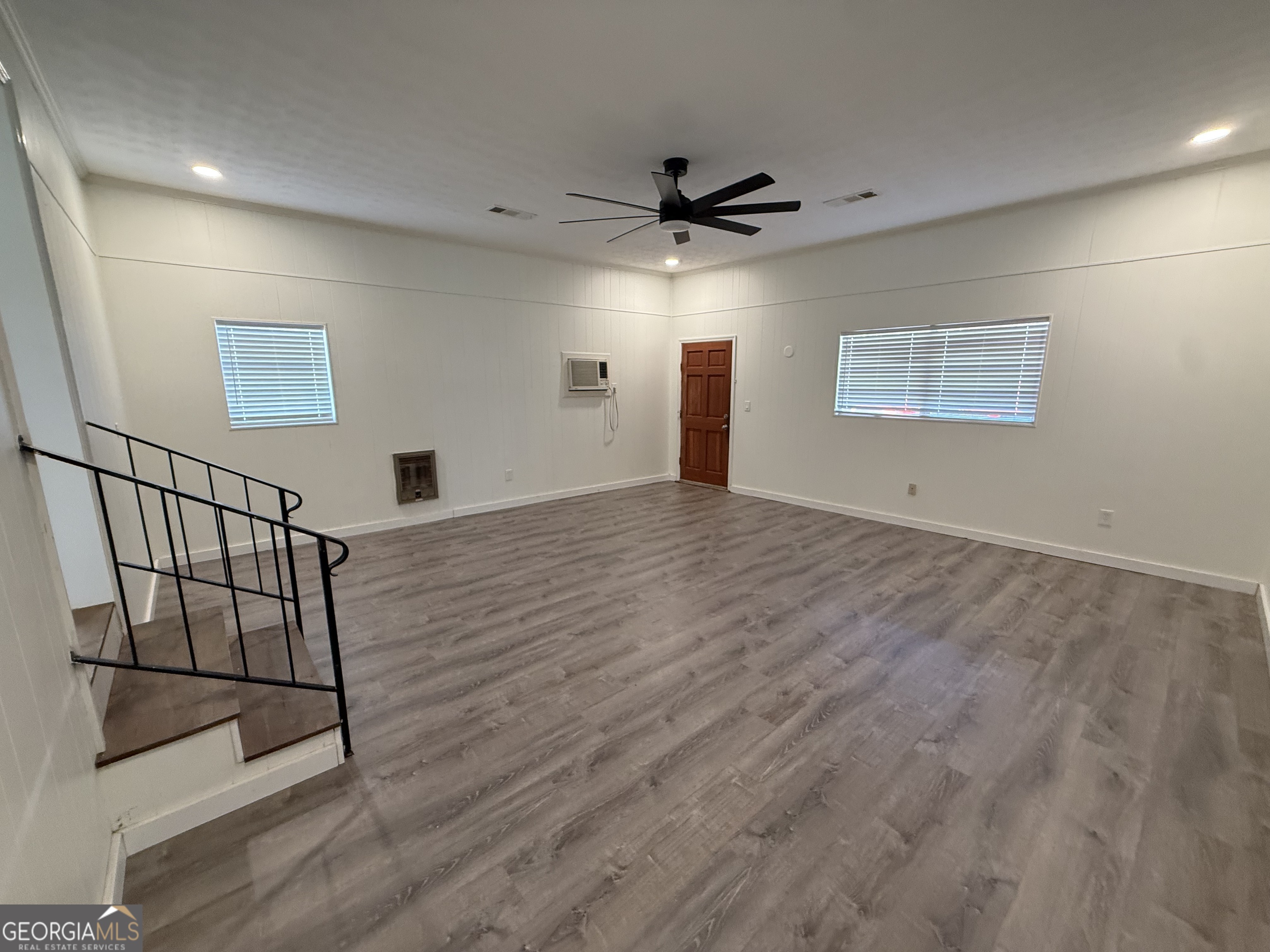 108 Plum Street Dublin, GA 31021 - Photo 31 of 33 en empty room with wooden floor and windows